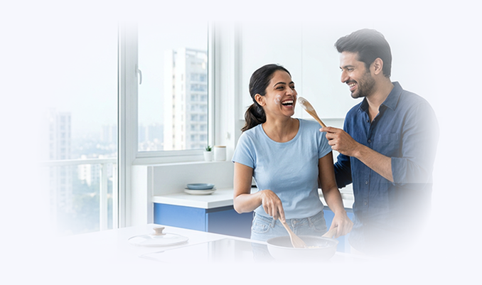 Couple smiling while cooking